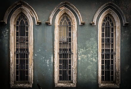 white closed windows with brown building on front thumbnail