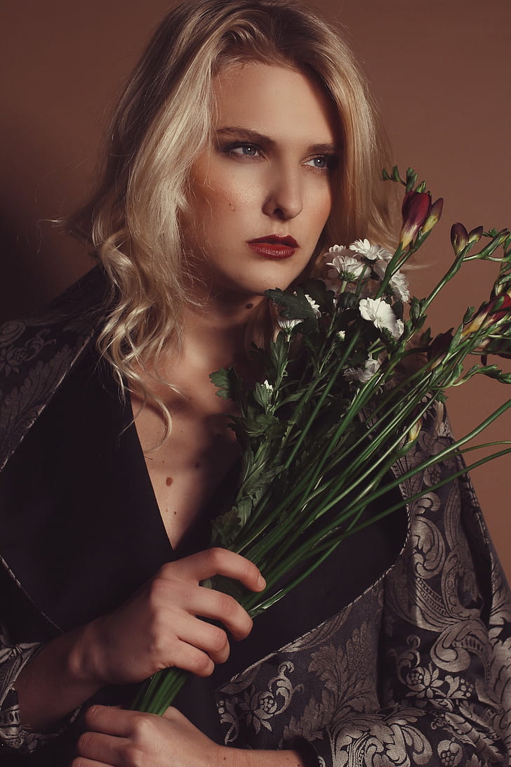 woman holding a flower bouquet