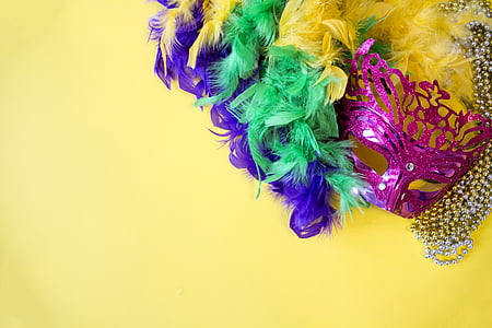 multicolored party mask on yellow surface thumbnail