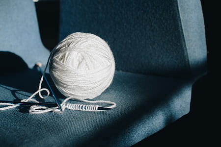shallow focus photography of white yarn thumbnail