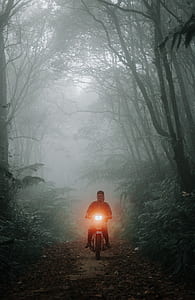 person on white motor scooter thumbnail