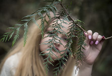 woman holding tree branch thumbnail