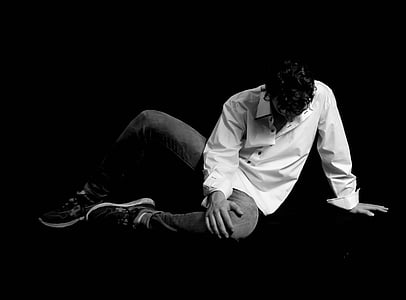 gray scale photo of man wearing white dress shirt and pants thumbnail