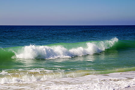 photography of sea waves under blue sky at daytime thumbnail