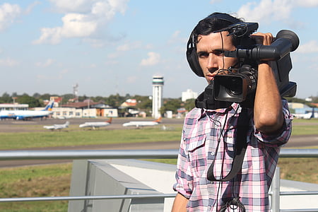 man holding video camera thumbnail