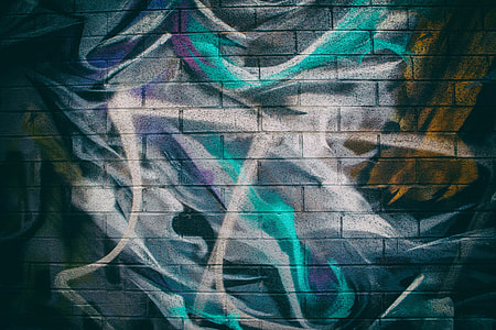 Close-up shot of colourful street art on a brick wall in Williamsburg, Brooklyn, New York City thumbnail