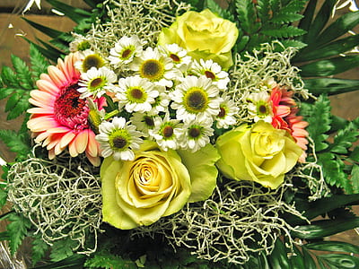 closeup photo of yellow rose flowers, pink Gerbera daisy flowers, and white daisy flowers bouquet thumbnail