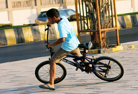 boy riding black full-suspension bike thumbnail