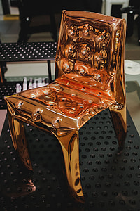 Various designer chairs and tables on an exhibition thumbnail