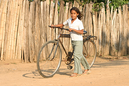 girl carrying black bicycle thumbnail