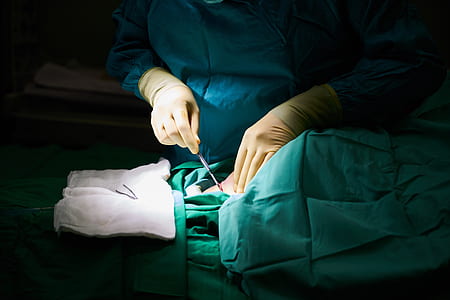man holding gray hospital tool thumbnail