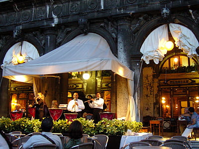 band playing instruments in restaurant thumbnail
