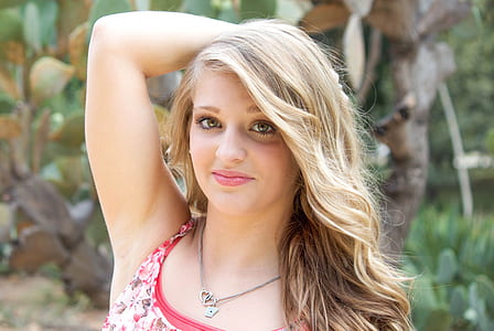 portrait photography of woman in red sleeveless top thumbnail