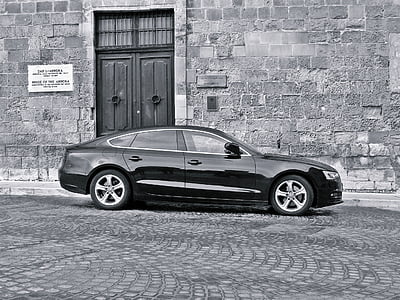 grayscale photography of black sedan thumbnail