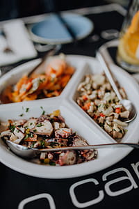 Dishes with various seafood at dinner table, O Camilo Restaurant, Portugal thumbnail