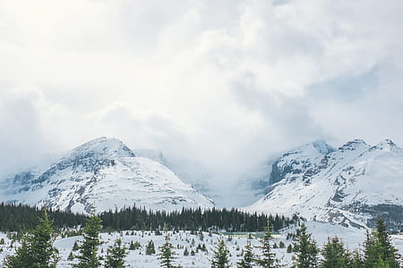 white snow covered mountain under white clouds thumbnail
