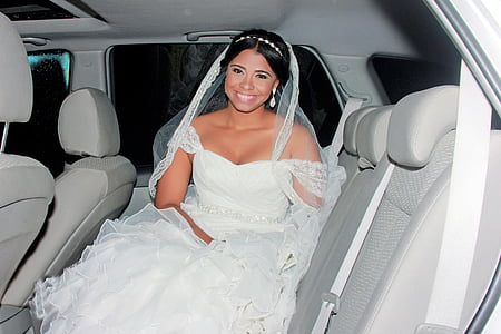 woman in wedding dress inside vehicle thumbnail