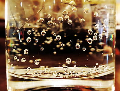 close-up photo of clear glass container with liquid thumbnail