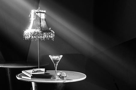 grayscale photography of cocktail glass on table thumbnail