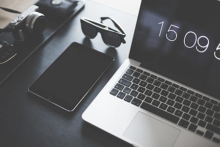 black iPad mini and gray and black laptop computer thumbnail