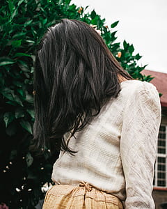 woman covering her face with hair thumbnail