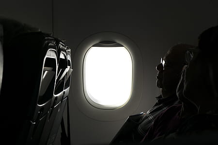man sitting on plane seat thumbnail