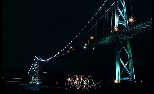 low-angle photography of bridge during nighttime thumbnail