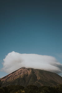 white clouds on mountain summit thumbnail