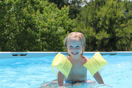 infant smiling on swimming pool thumbnail
