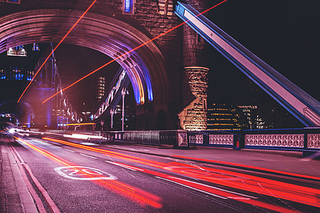 Traffic and car light trails on Tower Bridge in London thumbnail