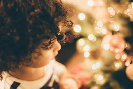 macro shot photography of toddler looking on lights thumbnail