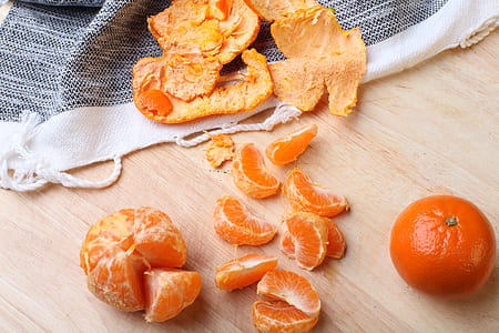orange and peel on beige surface thumbnail