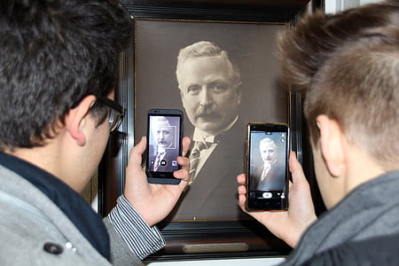 two men taking photo of portrait poster thumbnail