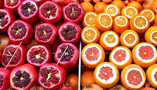 two round red and orange fruits thumbnail
