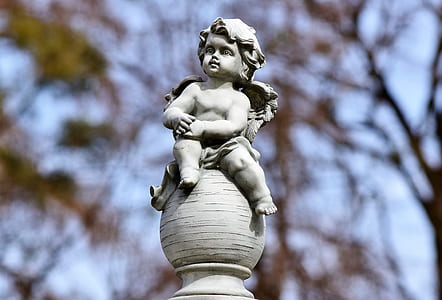 selective focus of cherub statue thumbnail