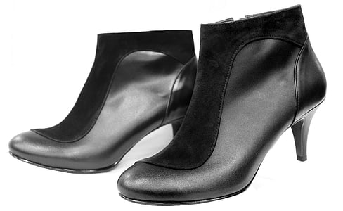pair of women's black leather kitten heeled booties thumbnail