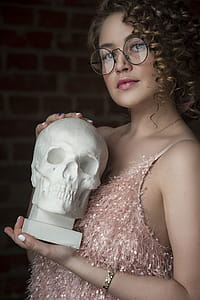 Woman Holding Skull Replica thumbnail