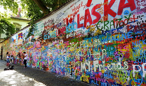 photo of person standing near graffiti artwork thumbnail