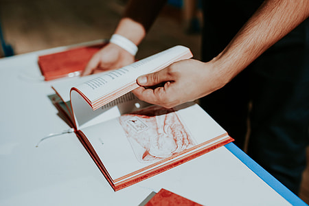 Red book on a white table thumbnail