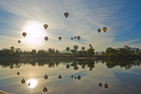 hot air balloon event during day time thumbnail