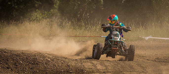 Man Riding Atv on Race Track thumbnail