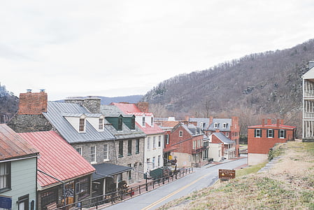 red, blue, and gray houses near mountain thumbnail