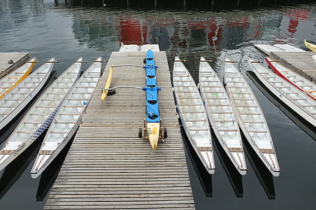 blue and brown boat on dock thumbnail