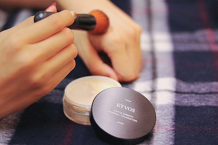 person holding makeup brush thumbnail
