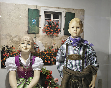 boy and girl doll near wall thumbnail
