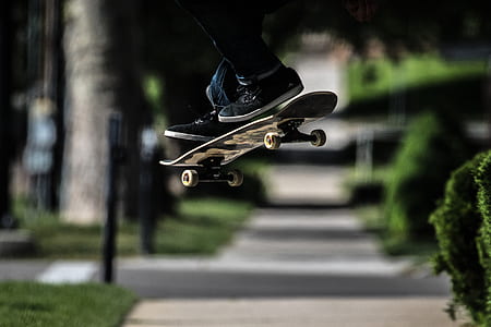 man playing skateboard near plant thumbnail