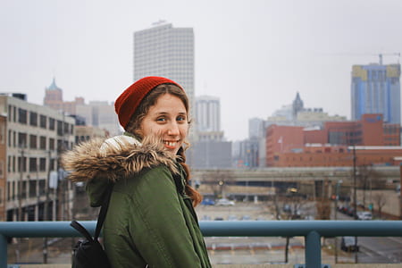 women standing beside the rail smiling thumbnail