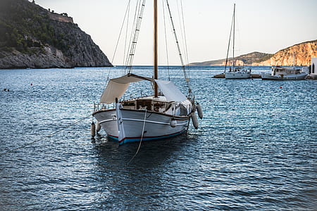 white and blue motorboat on sea thumbnail