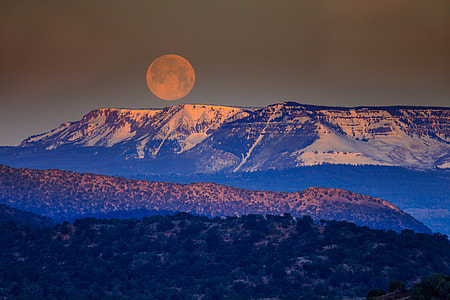 snow cap mountain under full moon thumbnail
