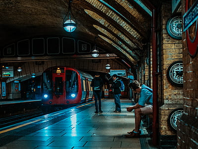 two men waiting near train queue thumbnail